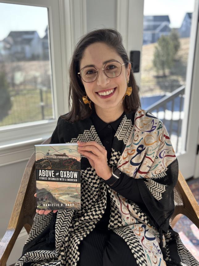 photo of author Dr. Danielle Raad with her new book, Above the Oxbow