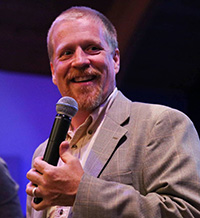 photo of a man with a microphone