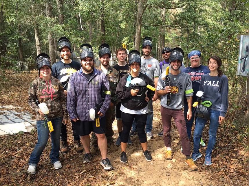 Graduate students at a paintball event