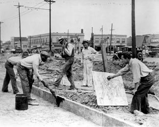 Michigan artist Alfred Castagne sketching WPA construction workers By an unknown photographer, May 19, 1939