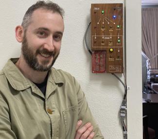 Joseph Kellner outside his office with his electronic message board