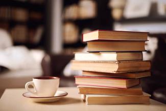 picture of a stack of books and a cup of tea
