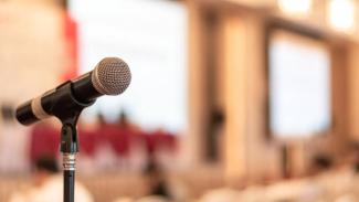 Image of a mirophone in a lecture hall