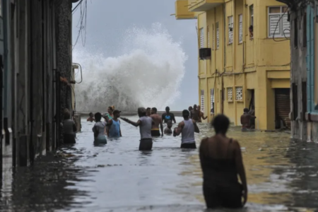 Hurricane Irma and residents in Cuba photo - wading through the city