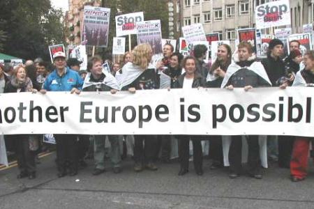 protest group advocating for de,ocracy in europe with banner - photo