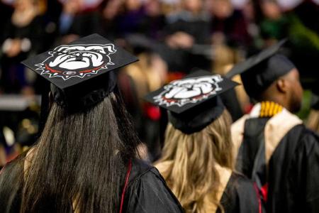 photo of uga graduates in graduation regalia