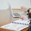 image of a grad workshop with laptop and notes