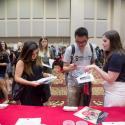 photo of new students at a previous graduate school information fair