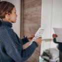 photo of a woman practicing her speech in the mirror